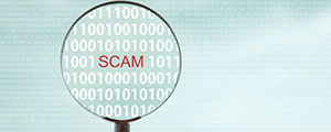 Magnifying glass highlighting the word "SCAM" in red.